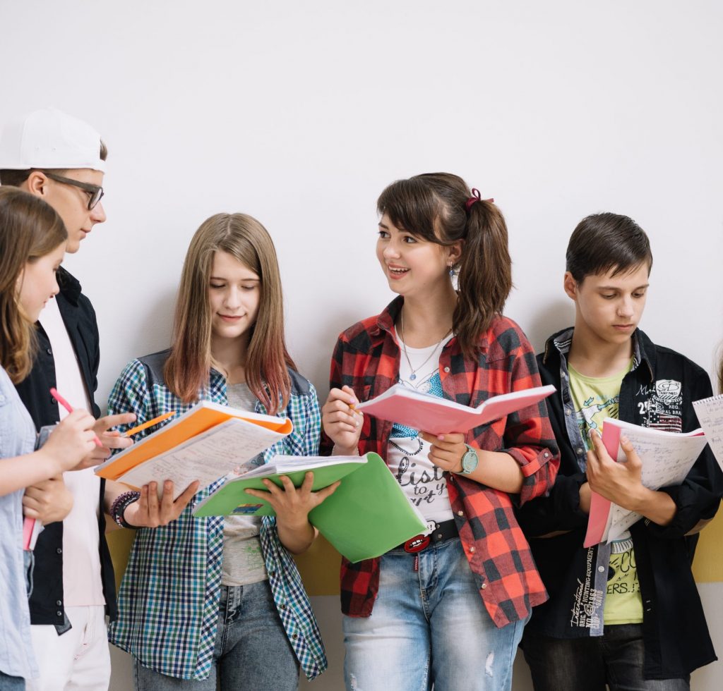 classmates-standing-with-textbooks