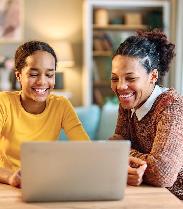Mother,And,Daughter,Doing,Homework,With,Laptop,At,Home.,Mom